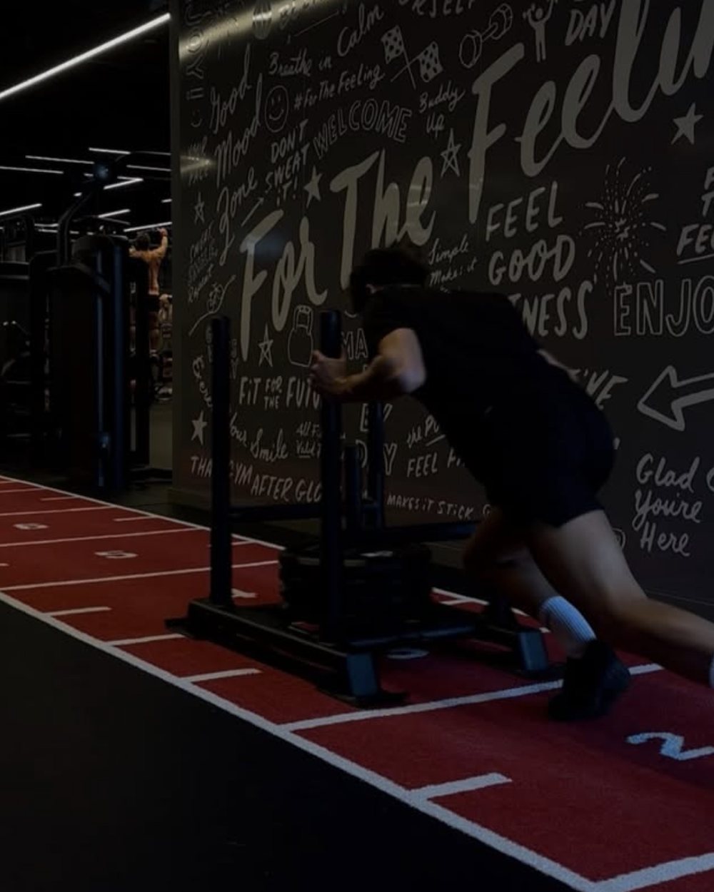 Sled push on an indoor sprint track